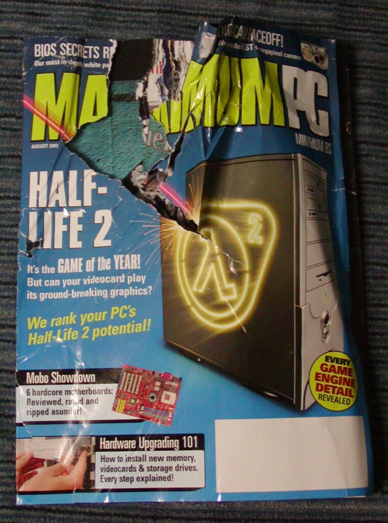 Front cover of Maximum PC, August 2003. Torn through the top half of the cover and multiple pages inside.